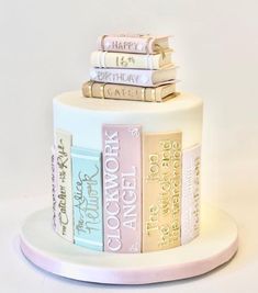 a cake with books stacked on top of each other