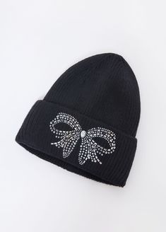 Embrace the chill in our ribbed-knit beanie, adorned with dazzling bow-shaped crystal embellishments. This cozy essential blends warmth and glamour, perfect for those frosty days when you still want to shine. Embellished Beanie, Black Dress Work, Ribbed Knit Beanie, Knit Pom Pom, Fall Winter Fashion, Hats Accessories, Winter Outerwear, Midi Dress Casual, Ashley Stewart