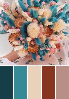 a color palette with different shades of blue, brown and white flowers in the center