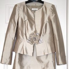 Gorgeous Cocktail Suit In Neutral Shade For Weddings, Graduations, Special Occasions, Parties Or Semi-Formal Events! Beautiful Lightweight Suit Tailored From Rich Champagne Colored Dupioni Silk Fabric, Fully-Lined With Escada Logo Lining. Made In Slovenia. Tagged Size Eu40. Jacket Front And Sleeve Bottoms Are Embellished With Silk And Rhinestone Floral Applique, Matching Skirt Has A Side Zipper. Timeless Design. Pre-Owned Vintage, In Excellent Condition. Worn Only Once. Measurements: Jacket Shoulders - 16.5in, Bust - 39in, Waist - 35in, Shoulder To Hem - 20.5in, Sleeves - 24.5in ; Skirt Waist - 33in, Hips - 40in, Length - 24in. Ships Fast From Smoke And Pet Free Home. Tailored Embellished Evening Sets, Tailored Embellished Sets For Evening, Chic Embellished Formal Sets, Elegant Embellished Evening Sets, Embellished Sets For Workwear, Elegant Fitted Embellished Set, Fitted Embellished Sets For Workwear, Embellished Fitted Sets For Workwear, Elegant Embellished Long Sleeve Sets