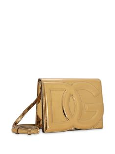 logo-embossed metallic-effect bag from DOLCE & GABBANA featuring gold-tone, calf leather, metallic finish, embossed logo to the front, concealed magnetic fastening, adjustable detachable shoulder strap and main compartment. Size Info UNI Color Detail Golden Made In Italy Material 100% Calfskin Season One Fall-Winter Season Two Fall-Winter Product bags.. Brand Dolce & Gabbana Size And Fit Width 7,87 in / 20 cm Height 6,3 in / 16 cm Depth 2,17 in / 5,5 cm Luxury Rectangular Shoulder Bag With Logo Plaque, Luxury Shoulder Bag With Logo Plaque And Top Handle, Luxury Shoulder Bag With Top Handle And Logo Plaque, Rectangular Gold Shoulder Bag With Logo Plaque, Luxe Gold Leather Bag, Gold Leather Shoulder Bag With Gold-tone Logo Plaque, Luxury Rectangular Shoulder Bag With Gold-tone Logo Plaque, Designer Crossbody Shoulder Bag With Logo Plaque, Luxury Gold Leather Shoulder Bag