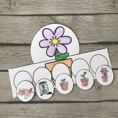 a flower pot with flowers on it next to cutouts for the parts of a flower