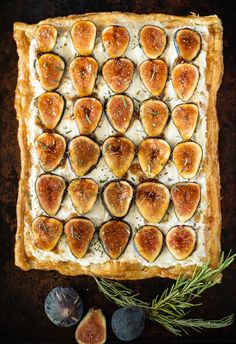 figs and goat cheese tart with rosemary sprigs on the side, ready to be eaten