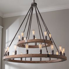 a wooden chandelier with light bulbs hanging from it