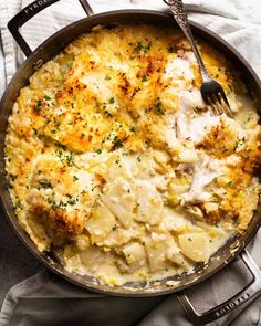 a skillet filled with mashed potatoes and chicken