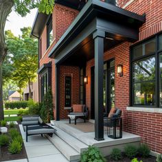 an outdoor patio with seating and trees in the background