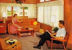 a man and woman are sitting in the living room talking to each other while they look out the window