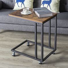 a coffee table with a book on it and a cup of coffee next to it