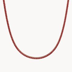 The Velvet tennis necklace is a dazzling piece of jewelry that showcases the intense beauty of rubies. Set in 14k gold, the necklace is adorned with bright red rubies in a brilliant cut. Available in two widths, 1.7 mm and 3.0 mm, and lengths of 35 cm and 40 cm, the necklace fits perfectly and provides a sparkling appearance. The elegant rubies give the necklace a vibrant brilliance that captures every gaze and enhances any outfit. A piece of jewelry that combines elegance and passion. Tennis Necklace, The Velvet, Bright Red, Ruby, Rose Gold, Velvet, Gold