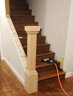 the stairs are being installed on top of the wood flooring in this home's entryway