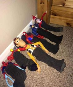 two dolls laying on the floor next to each other