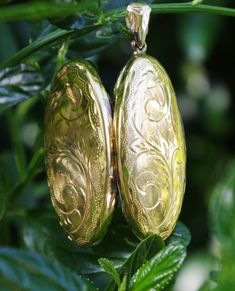 This superb oval shaped locket is Gold Plated. It is stamped 925 on the inside. This beauty is gold plated on silver. The hinge is in excellent working order and the locket still has a tight catch. This would be a lovely gift for a loved one or to keep photos of someone special close to your heart. . The locket measures approx 0.75 inches by 1.75 inches including the bail. Gold Oval Link Locket Necklace For Formal Occasions, Classic Gold Oval Locket Necklace, Gold Oval Heirloom Locket Necklace, Gold Oval Link Locket Necklace For Anniversary, Classic Oval Locket Necklace Stamped 14k, Oval Link Locket Necklace For Anniversary, Antique Gold Oval Locket Necklace For Keepsake, Antique Etched Oval Locket Necklace, Antique Gold Oval Locket Necklace For Anniversary