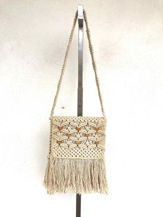 Vintage 1970s cream crochet woven bohemian crossbody bag___________________________________MEASUREMENTSLength: 32"All measurements are taken with the garment laid flat.__________________________________CONDITION:Excellent Vintage ConditionAll items at Time Warp are vintage, so there is some wear. They may not be 100% free of minor defects, as they have already been loved. We list items by condition and note any flaws.INV 2091 Bohemian Vests, Versace Designer, Crochet Weaves, Bag Obsession, Time Warp, Small Clutch, Purple Tank, Leather Tooling, Vintage 1970s