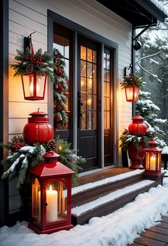 two red lanterns with christmas decorations on the front porch