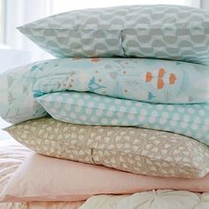 four pillows stacked on top of each other