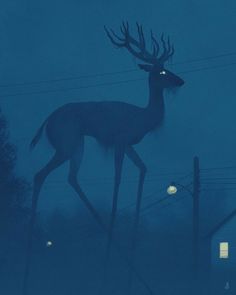 a deer statue in the middle of a foggy night