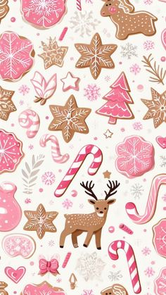 christmas cookies and candy canes are arranged on a white background with pink and brown decorations