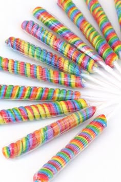 multicolored striped straws are arranged in a circle