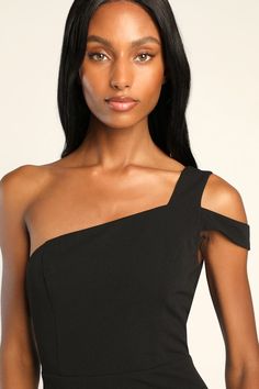 a woman wearing a black dress with one shoulder and an asymmetrical top