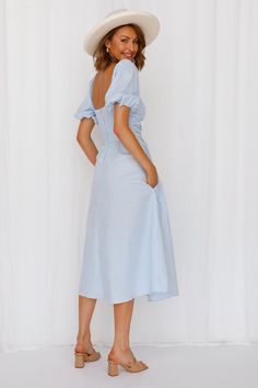 Length from shoulder to hem of size S: 114cm. Blue midi dress. Lined. Cold hand wash only. Model is a standard XS and is wearing size XS. True to size. Lightweight, non-stretchy and woven fabric. Elasticised waist-back. Back zipper. Cotton/Linen. Get the picnic basket and sweet cookies, because it's time to live your best cottage core life! The Milkmaiden Midi Dress features short puffy sleeves, a faux cowl bust detail and a long skirt. Style yours with mules and a basket bag. Summer Tea-length Dresses For Brunch, Summer Tea-length Brunch Dress, Blue Midi Dress With Gathered Sleeves For Brunch, Light Blue Mid-length Summer Dress, Light Blue Ruched Midi Dress, Summer Tea-length Dress Down Dresses, Spring Off-shoulder Midi Dress For Daywear, Spring Ruched Tea-length Dress, Light Blue Off-shoulder Midi Dress