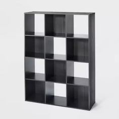 a black and white book shelf with squares on it