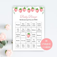 a baby shower game with pink flowers and greenery