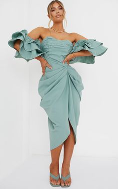 Get ready for your next big occasion in this midi dress. Featuring a sage green material with a bardot neckline, frill sleeves and a draped design, team this dress with strappy heels and complete the look with a clutch.   Length approx 105cm/41 (Based on a sample size UK 8)   Model wears size UK 8/ EU 36/ AUS 8/ US 4   Model Height - 5ft 5 Green Off Shoulder Dress, Draped Midi Dress, Robes Glamour, Draped Midi Dresses, One Shoulder Midi Dress, Frill Sleeves, Designer Drapes, Green Midi Dress, Dress Clothes For Women