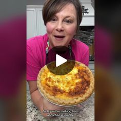 a woman holding a pizza on top of a pan in front of her face with an animated caption