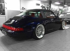 a black sports car parked in a garage