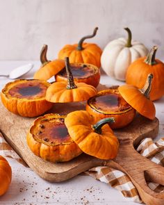 small pumpkins on a wooden cutting board