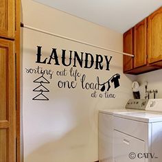 a laundry room wall decal that says laundry sorting out life is one load at a time