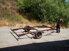 a man is standing next to a trailer