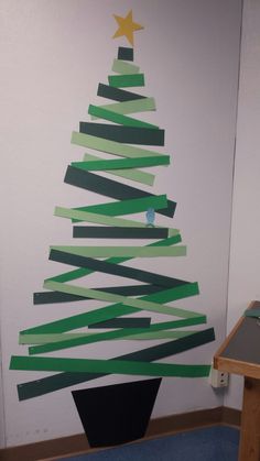 a christmas tree made out of strips of paper