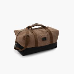 a brown and black duffel bag on a white background