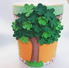 a paper cup that has a tree on it