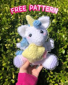 a hand holding a crocheted stuffed animal with the words free pattern on it