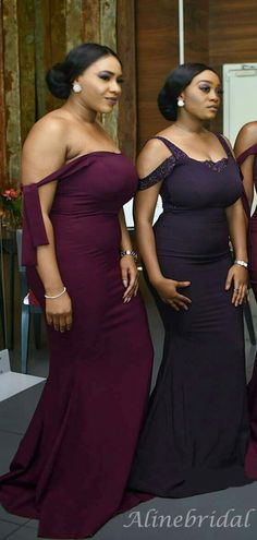 three women in long dresses posing for the camera with their hands on their hipss