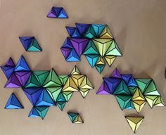 several different colored origami pieces on a table