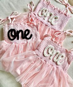 Our custom hand embroidered name tutus are sure to look adorable on the sweet little one in your life!  Give them as gifts for baby showers, name announcements, first birthday's, Xmas gifts, and more!  These tutu's are also perfect to wear for your little one's first birthday!  Just pick out the color tutu and yarn you want and leave the rest up to us!  Your little girl will look absolutely adorable in her StitchedxStacey custom tutu! Choose the color of your tutu romper in the above drop down. White Sweet Tutu Dress For Birthday, Sweet White Tutu Dress For Birthday, Sweet White Tutu Dress For First Birthday, White Cute Tutu Dress For First Birthday, Cute Sleeveless Tutu Dress For First Birthday, Sweet Tulle Tutu Dress For Birthday, Cute Pink Tutu Dress For Baptism, Sweet Tutu Dress For Cake Smash, Cute Pink Tutu Dress For First Birthday