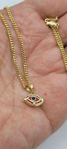 "14K GOLD RED EVIL EYE NECKLACE 20\"/14K ORO PURO CADENA DE OJO DE LA SUERTE-6.4GR. Shipped with USPS First Class. 14 K SOLID GOLD RED EVIL EYE NECKLACE .20\"LONG FIGARO CHAIN. REAL 14K GOLD (NOT PLATED OR FILLED).-- 6.4 GR--FOR GOOD LUCK AND PROTECTION PENDANT SIZE : 13 mm X 13 mm ---MADE IN ITALY-BEST QUALITY--- FREE GIFT BOX NOTE:THIS ITEM IS SHIPPED WITH SIGNATURE CONFIRMATION. CADENA DE OJO DE LA BUENA SUERTE EN ORO PURO 14K. 20\" LARGO FIGARO CADENA. COLOR ROJO .--6.4 GR-- PARA BUENA SUERT Luxury Red Necklace For Gift, Fine Jewelry Red Gold Plated Necklace, Fine Jewelry Red Gold-plated Necklace, Red Gold-plated Fine Jewelry Necklace, Luxury 14k Gold Red Necklace, Luxury Red 14k Gold Necklace, Red 14k Gold Polished Jewelry, Red 14k Gold Jewelry With Polished Finish, Red Gold Plated Necklace