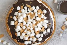 a pie with marshmallows and chocolate on top