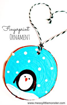 an ornament with a penguin on it and the words fingerprint ornament