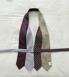 three ties laid out on top of each other