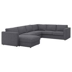 a gray sectional sofa with ottoman and footstool in front of a white background