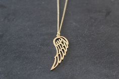 A lovely gold plated angel wing pendant hangs from a fine gold plated chain necklace. Angel wing pendant is matt gold plated over brass, size - 43.5 x 14.5mm Fine link chain necklace is gold plated, various sizes available, please select the length you require above. ★ All items arrive in a gift box with ribbon.  Ready to ship.  Personalized messages and direct shipping to the recipient available on request. ★ If you would like more than 1, please convo me.  I offer discounts for multiple purchases. Please read my shop policies for details on shipping, delivery etc. https://www.etsy.com/Littlemissjdesigns/policies ♥ ♥ ♥ Visit my boutique for more designs: ♥ ♥ ♥ http://www.littlemissjdesigns.etsy.com Thanks for looking! Little Miss J x © Little Miss J Designs 2020 All rights reserved Gift Box With Ribbon, Gold Angel Wings, Box With Ribbon, Angel Wing Necklace, Angel Wing Pendant, Gold Angel, Wing Necklace, Gold Plated Chains, Chain Link Necklace