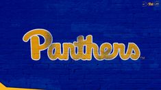 the word pittsburgh painted on a blue brick wall in front of a yellow and white stripe