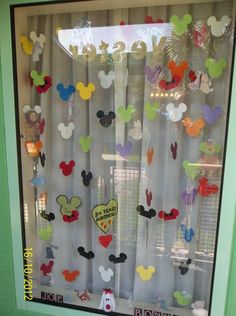 a window with mickey mouse decorations on it