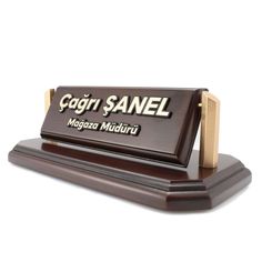 a wooden sign that says gogri sanel and has a name on it