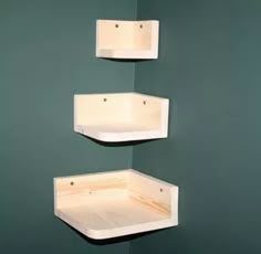 three wooden shelves mounted to the wall