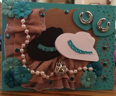 a card with an image of a cowgirl's hat and pearls on it